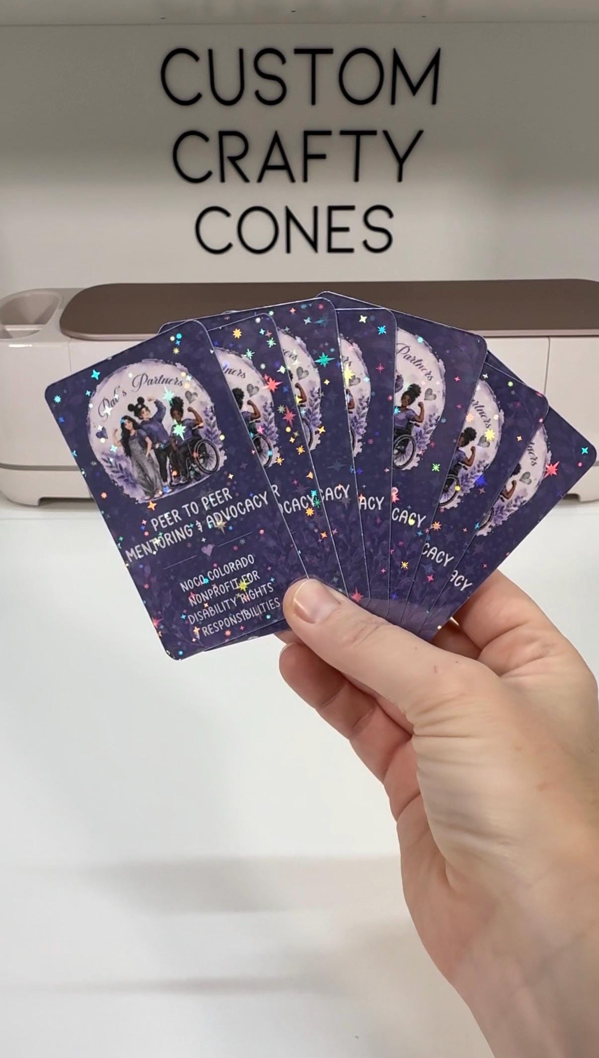 A fan of thick, rounded custom business cards printed in vivid color
