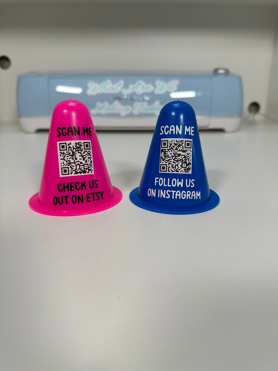 Pink and blue personalized mini traffic cones with custom QR codes