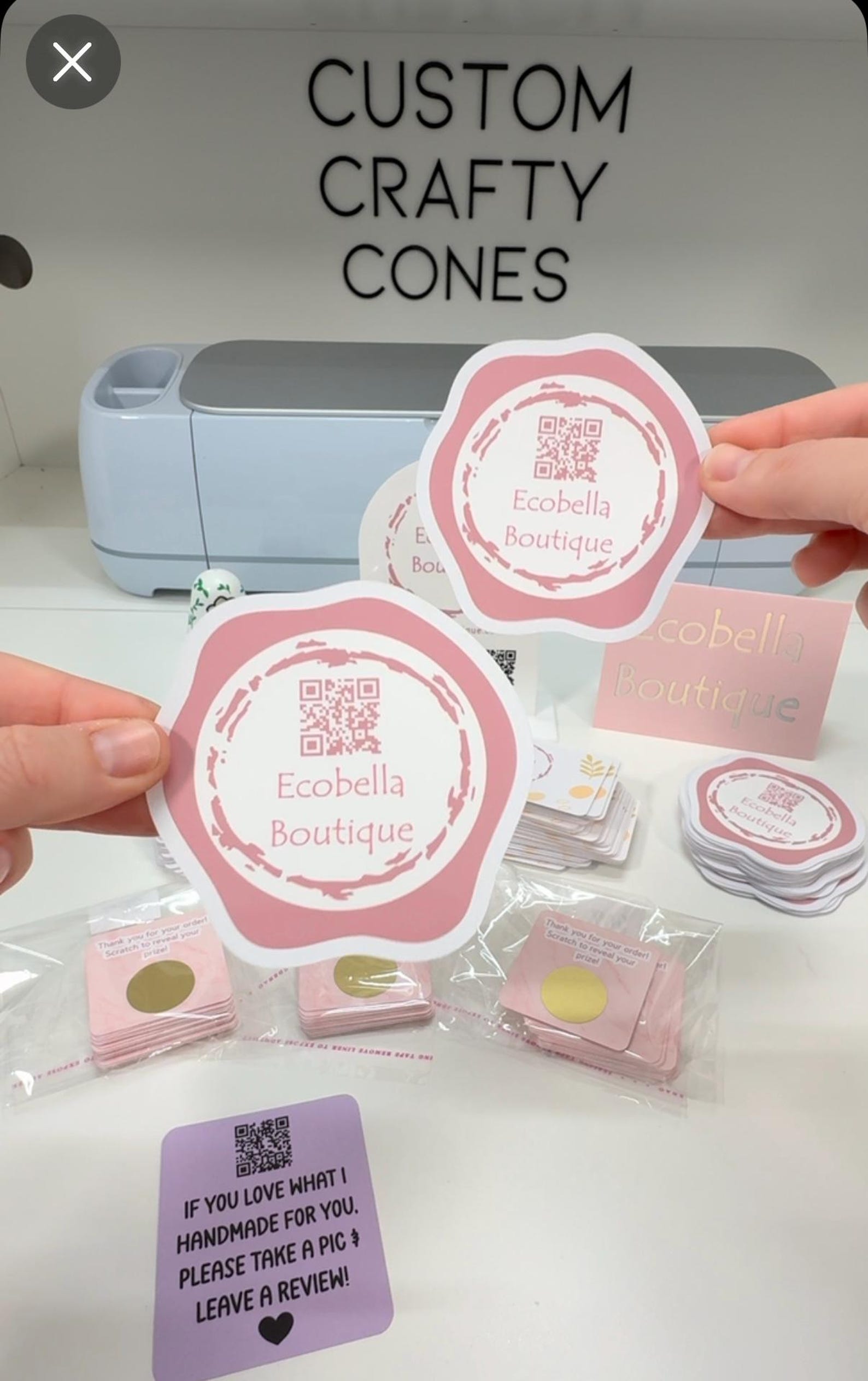 Personalized die-cut boutique stickers shown in Laura's studio