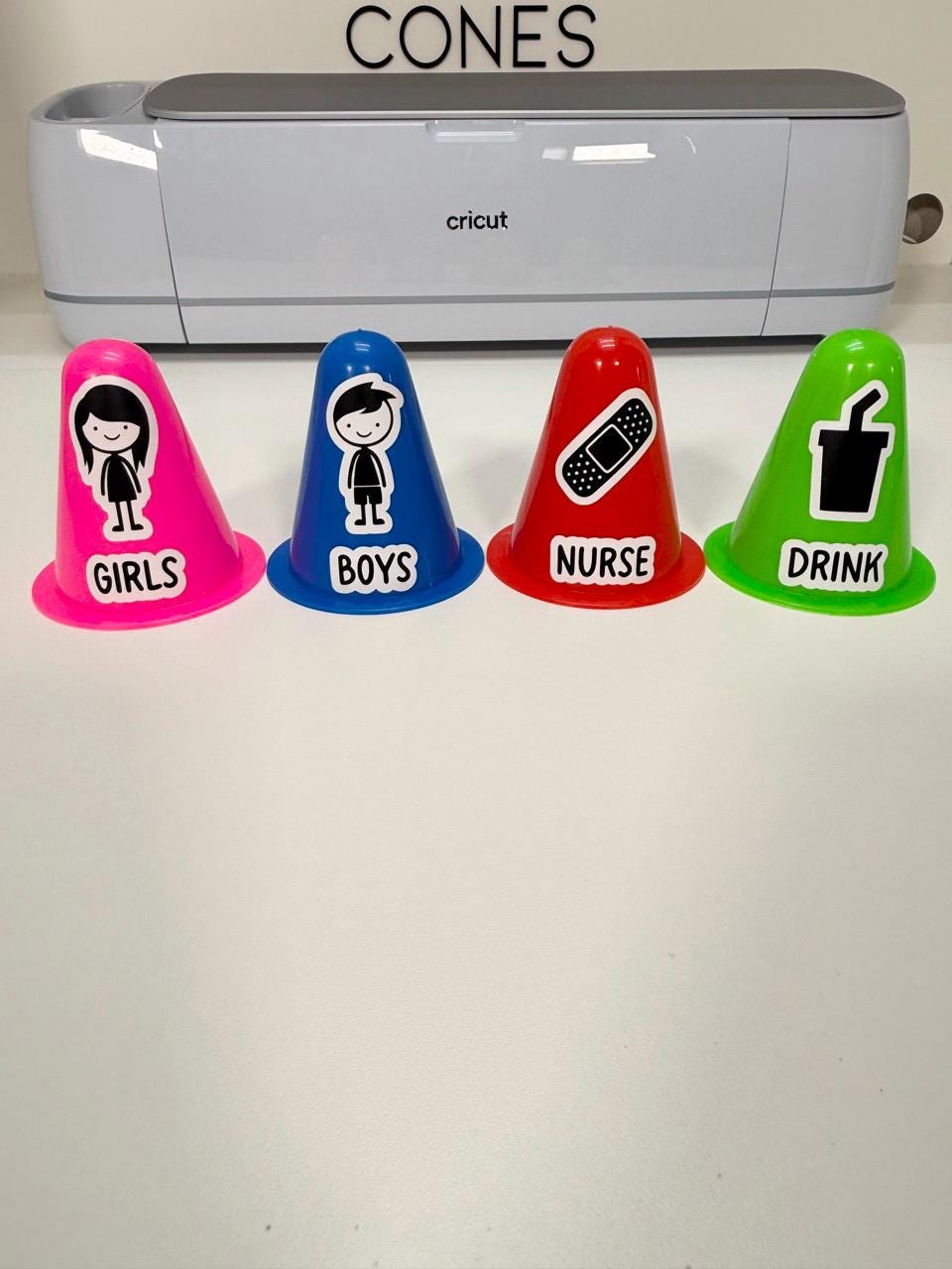 A colorful set of personalized mini traffic cone hall passes